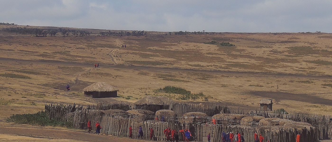 A village on an open plain below the Manyara escarpment